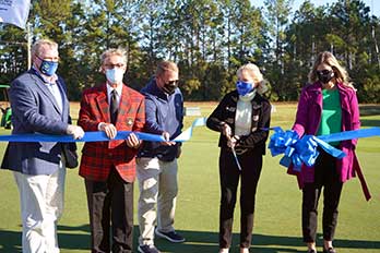 Dr. Fore Cutting Ribbon
