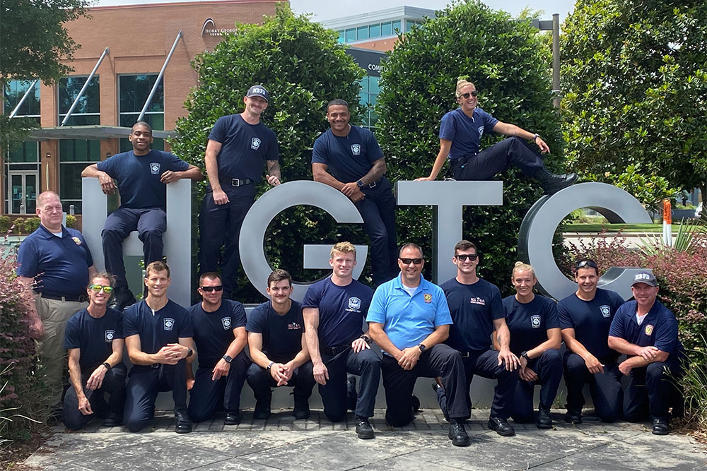 EMT Class pose in front of HGTC sign.