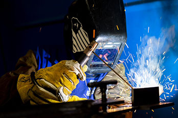 a man welds metal