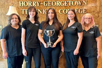 HGTC Surgical Technology Team Members and Professors display their 1st Place National Trophy.