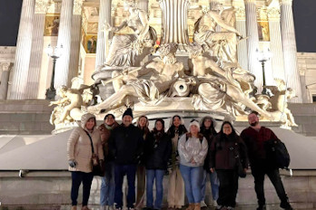 HGTC Students and Instructor in front of the Pallas Athene Fountain