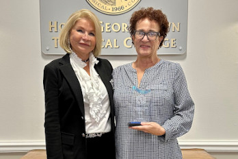 HGTC President, Dr. Marilyn Murphy Fore (left), presents Temporary Staff of the Year Award 2024, to Karen Focarrazo (right), Adjunct Faculty for Culinary Arts.