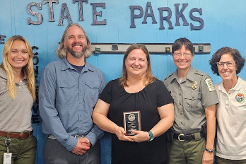 Lauren Roberts, HGTC Professor of Biology, receives her award at the recognition ceremony.